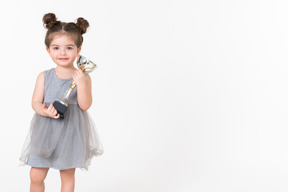 Little girl holding an award cup