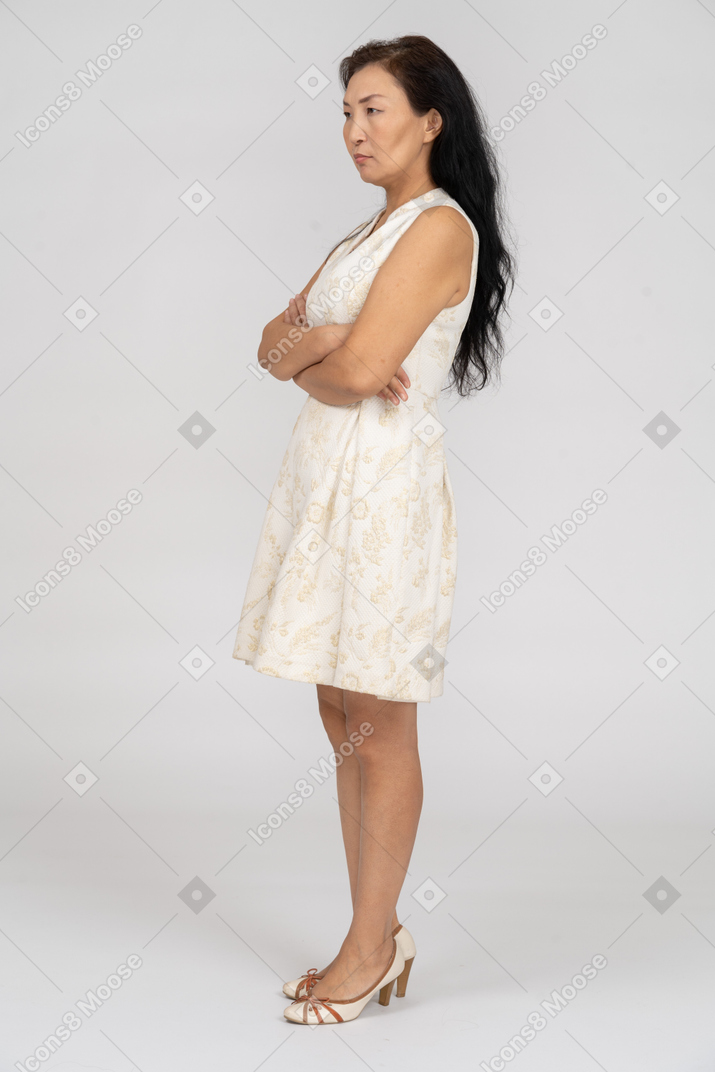 Woman in a white dress standing