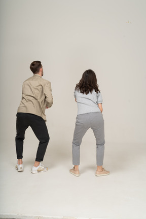 Back view of young people bending over