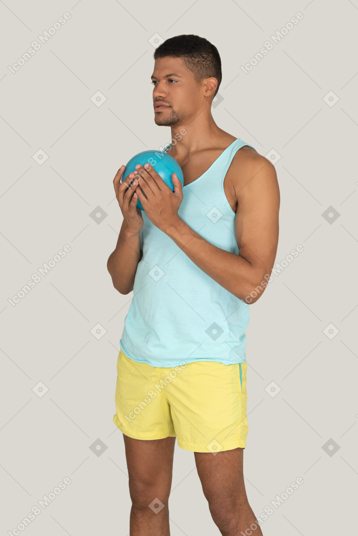 Man holding ball in hands