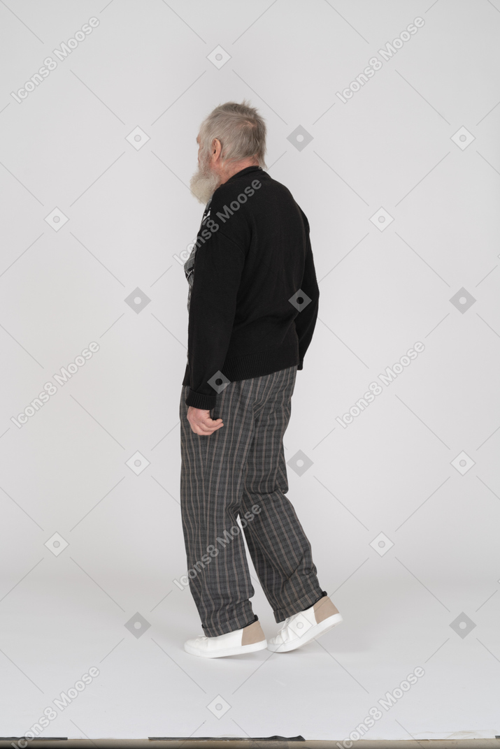 Elderly man walking away