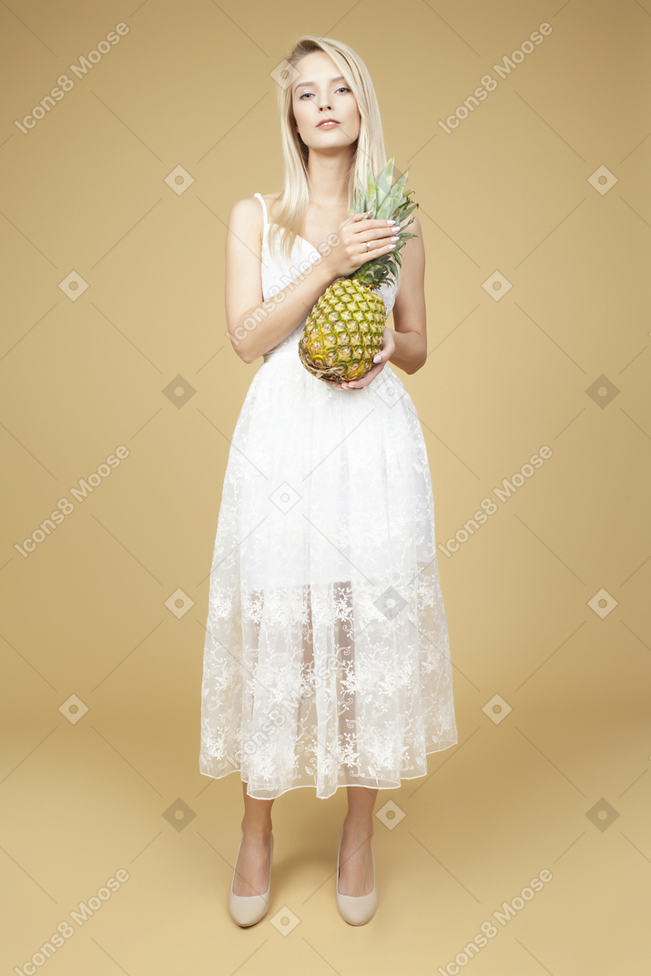 Beautiful bride holding a pineapple