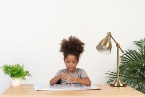 Good looking cute girl with books at the table