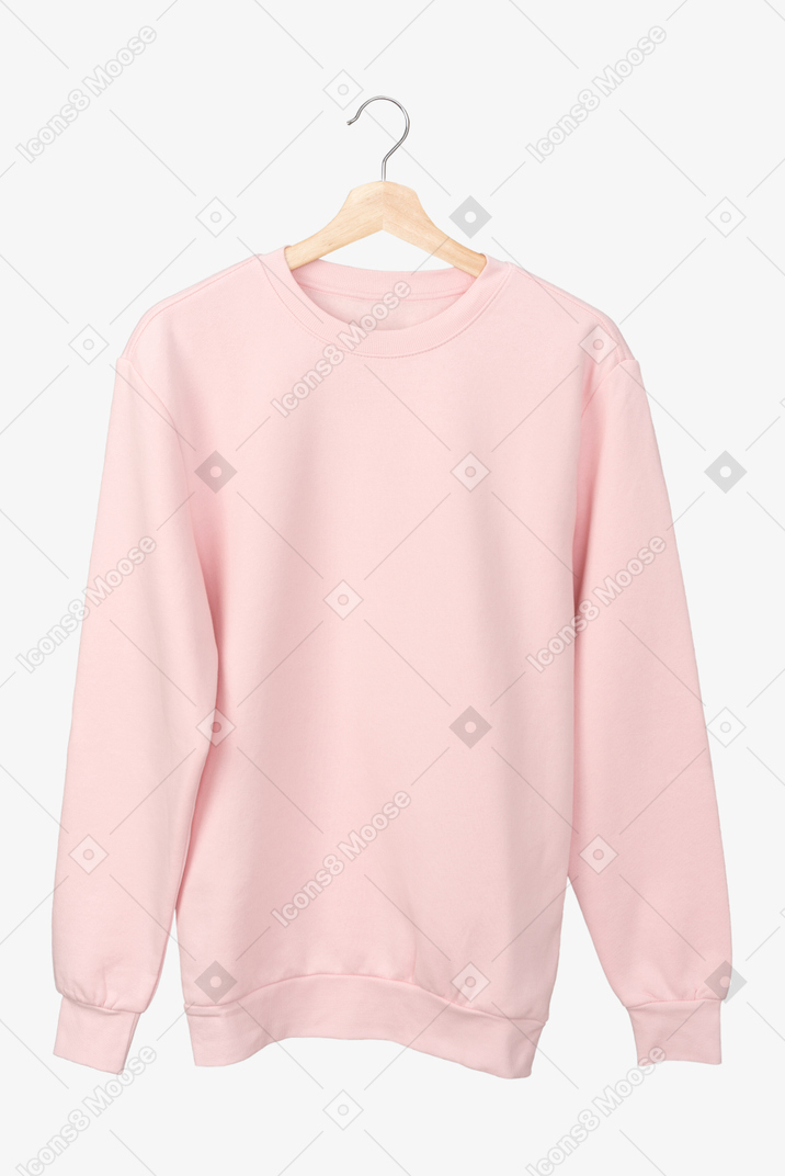 Pastel pink long sleeve t-shirt on a hanger