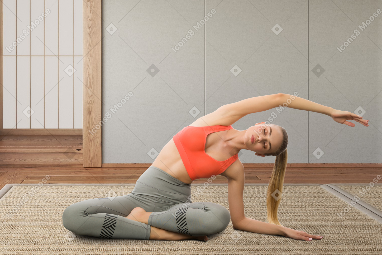 A woman is doing a yoga pose on the floor