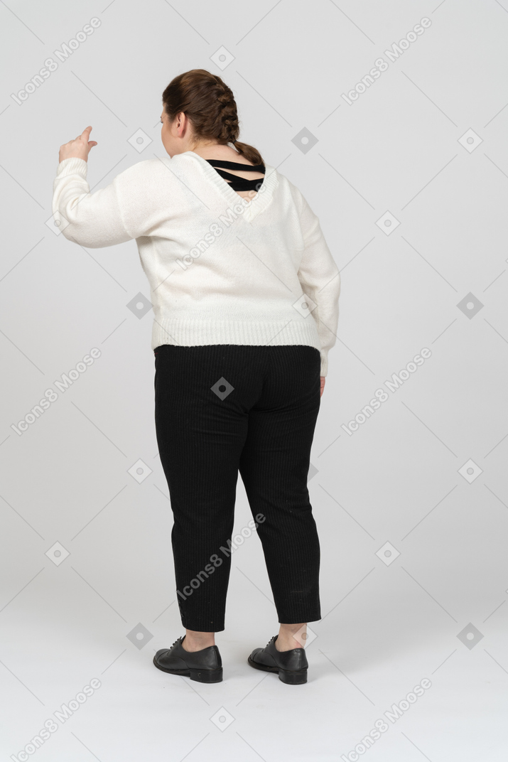 Plus size woman in casual clothes gesturing
