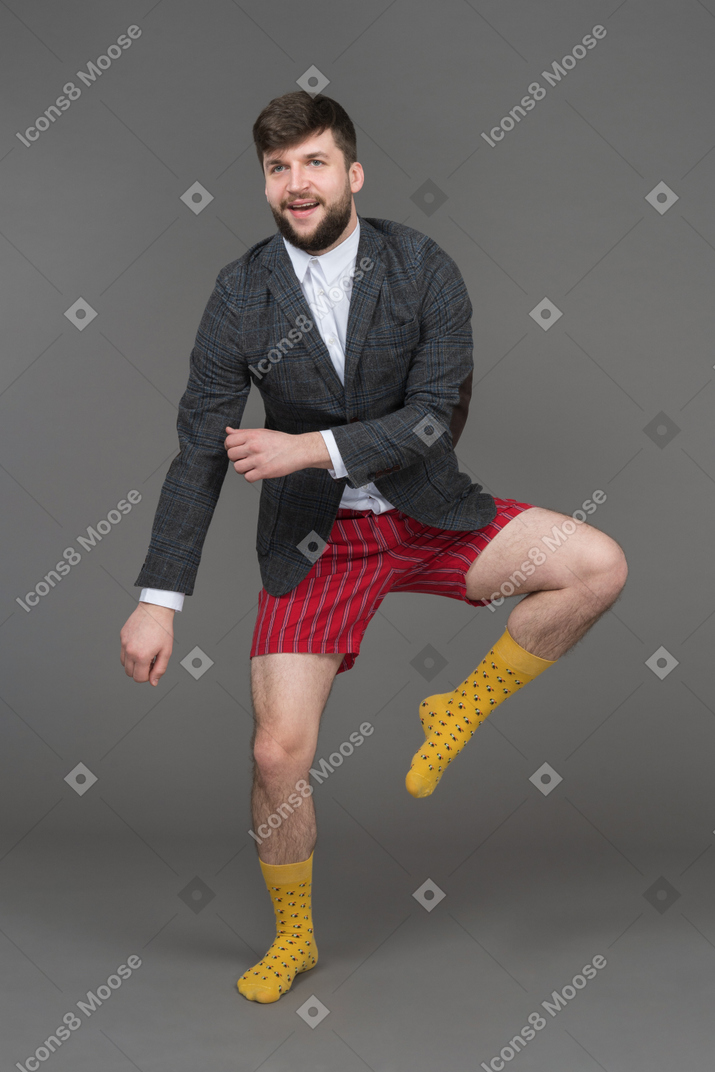 Young businessman dancing to the tune