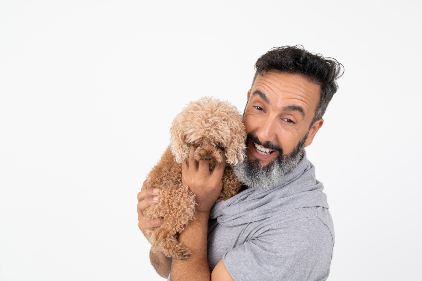 Happy  man holding a puppy