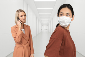 Two women standing in the corridor