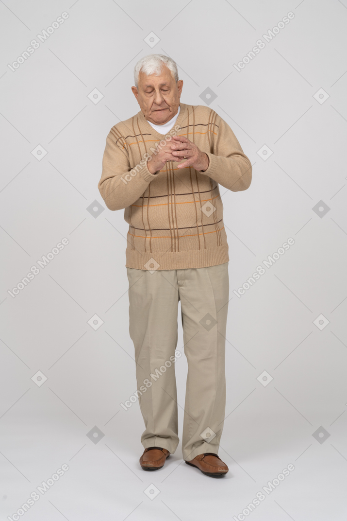 Front view of a scared old man in casual clothes