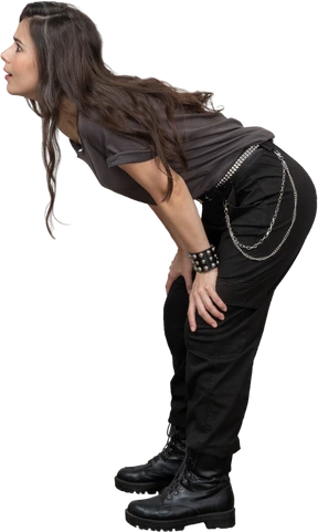 Side view of a questioning female rocker leaning forward