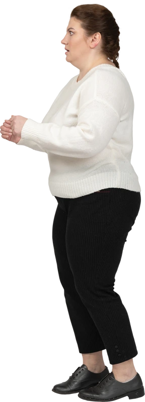 Scared plump woman standing in profile