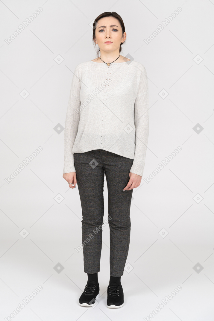Frown displeased woman isolated over white background