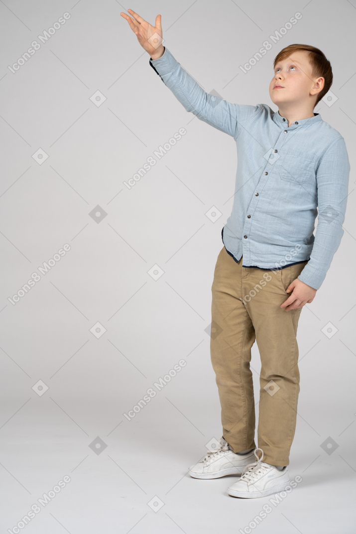 Boy pointing at something with hand