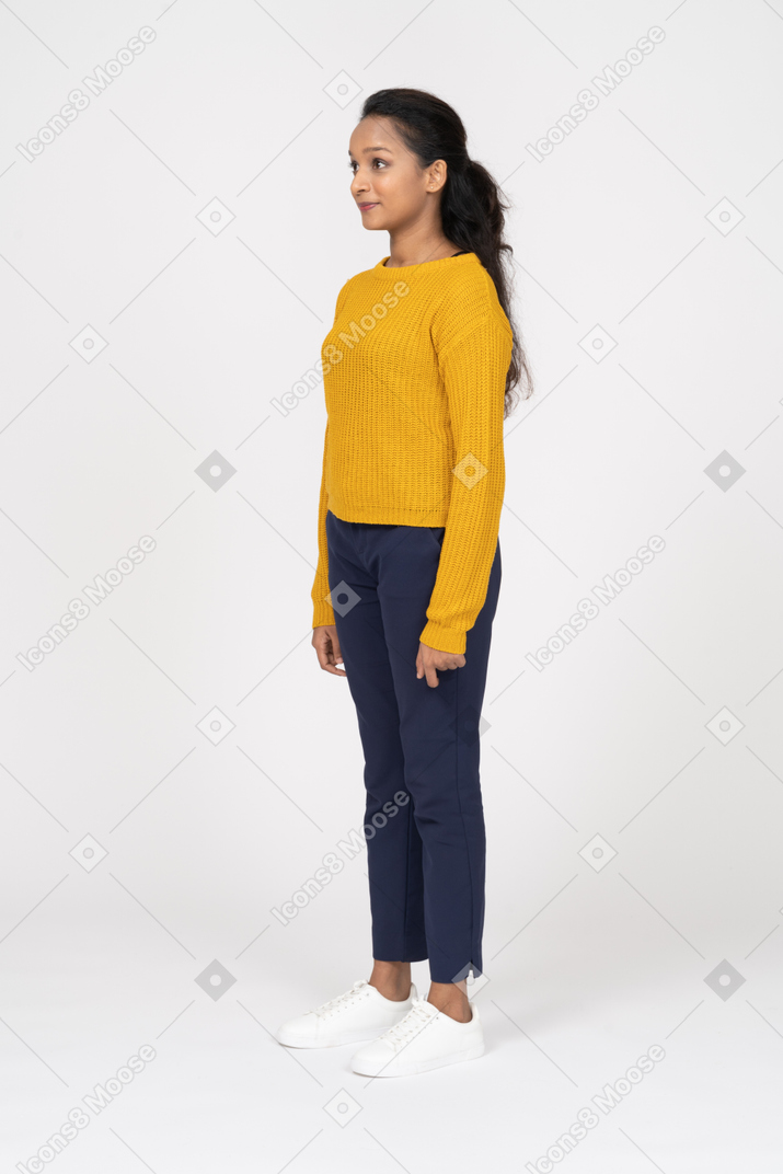 Side view of a happy girl in casual clothes