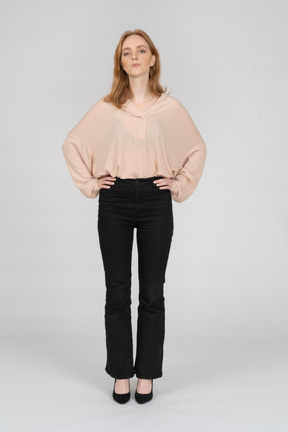 Woman in beautiful blouse standing