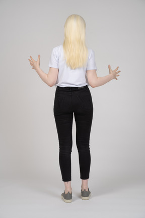 Back view of a woman gesturing