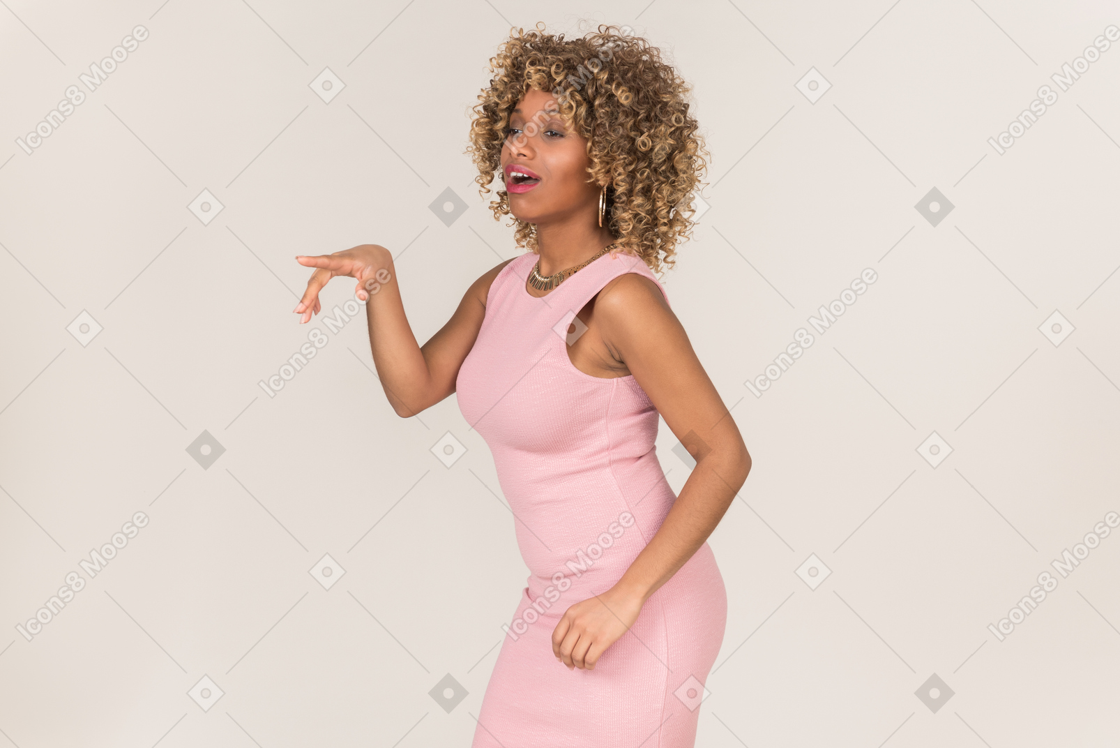 A woman in pink dress pointing at something