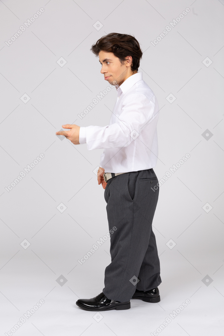 Side view of an office worker pointing at something