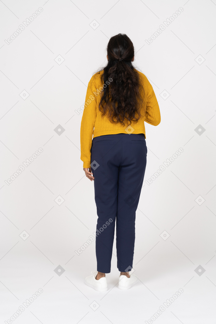 Rear view of a girl in casual clothes