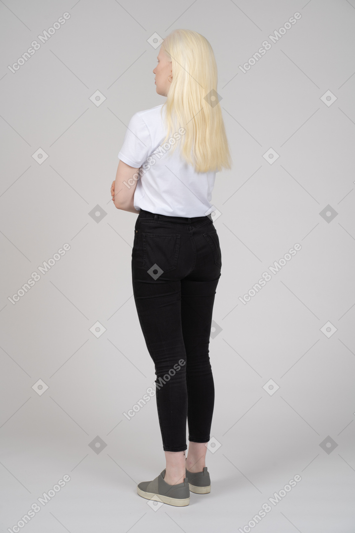 Back view of a young girl folding her arms