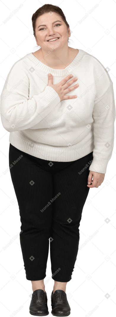 Front view of a happy plump woman in casual clothes