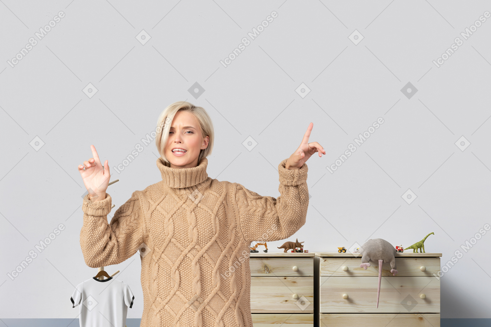 Woman standing in front of a dresser and pointing up