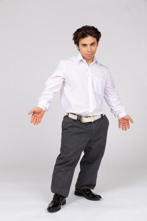 Young office worker spreading arms