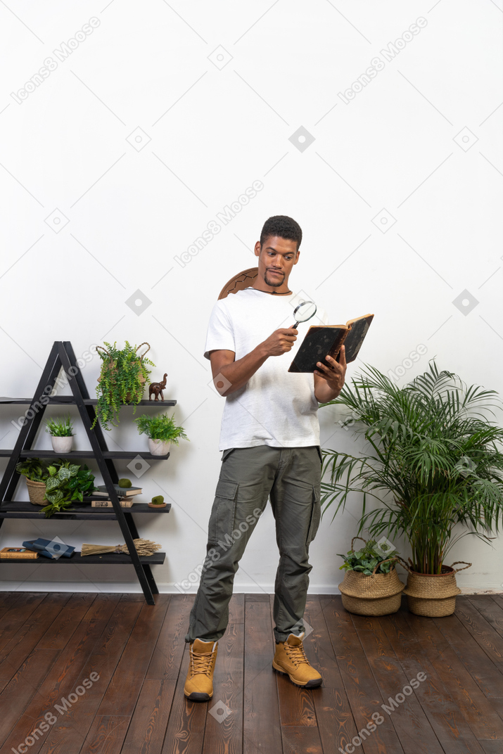Good looking young man with a book
