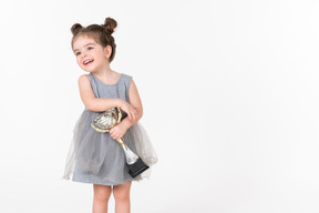 Little girl holding an award cup