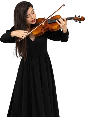 Close-up of a young emotional lady in black dress playing the violin
