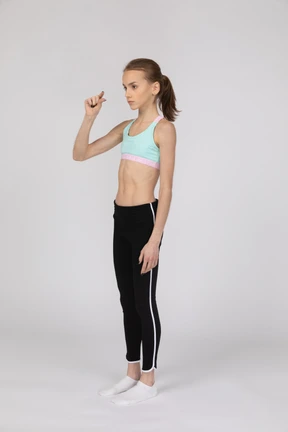Teen girl showing small amount of something