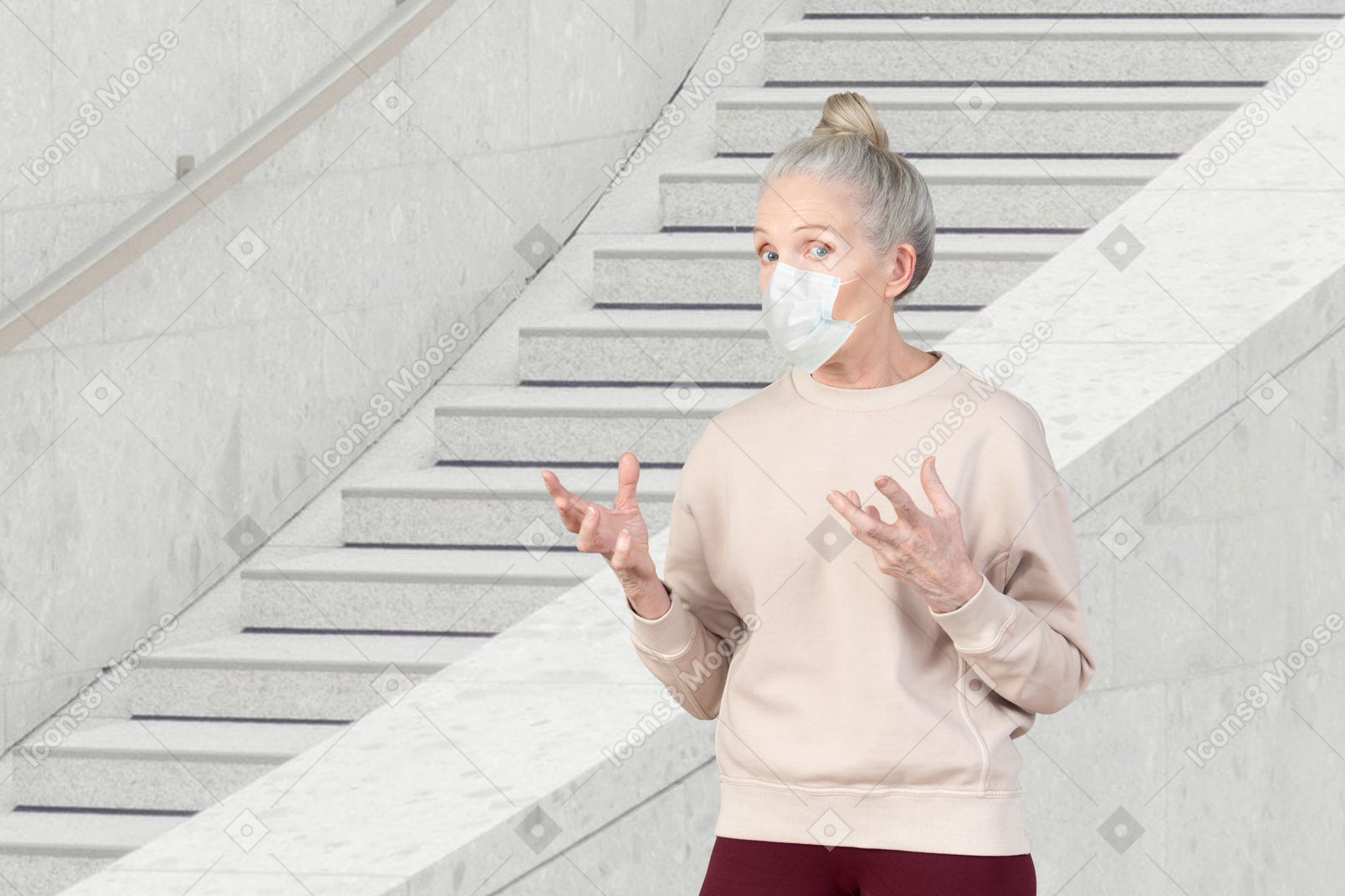 A woman wearing a face mask standing in front of a staircase