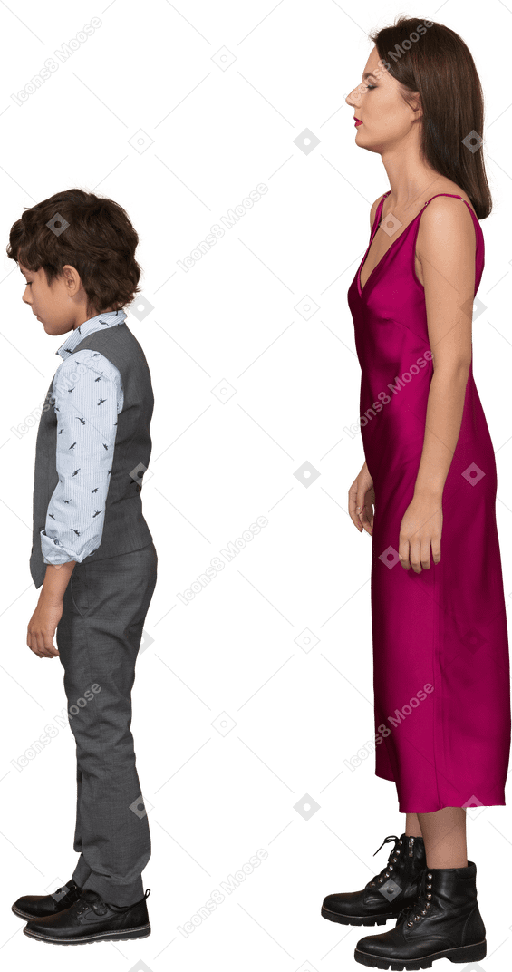 Boy and young woman standing in profile