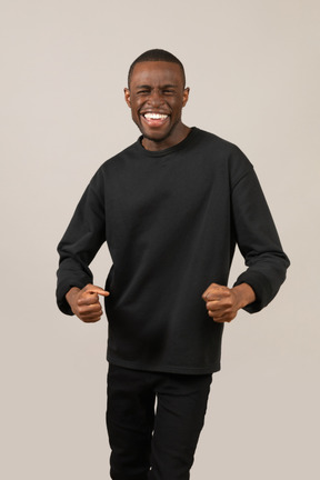 Front view of excited young man