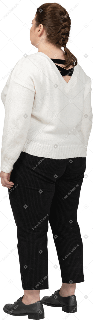 Plump woman in casual clothes standing