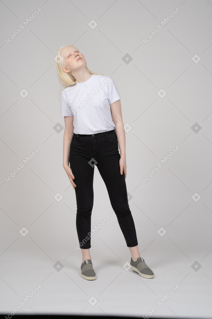 Girl standing and looking up