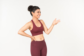 Indian girl in sporstwear checking fitness tracker