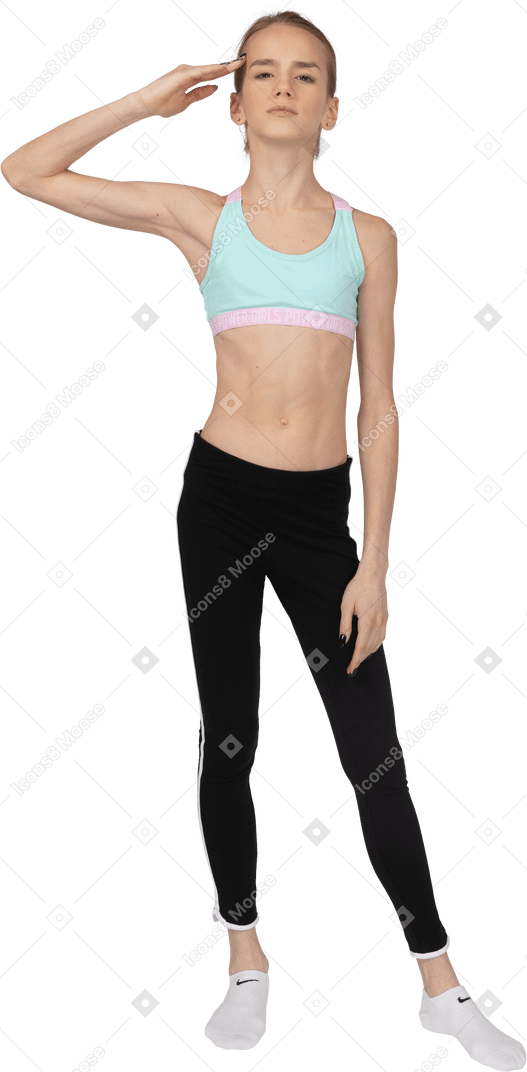 Front view of a teen girl in sportswear standing like a soldier