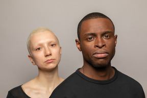 Young international couple looking at camera