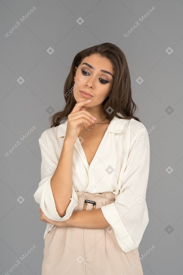 Portrait of a sad arab woman standing deep in thoughts