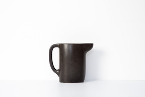 Brown ceramic mug with spout