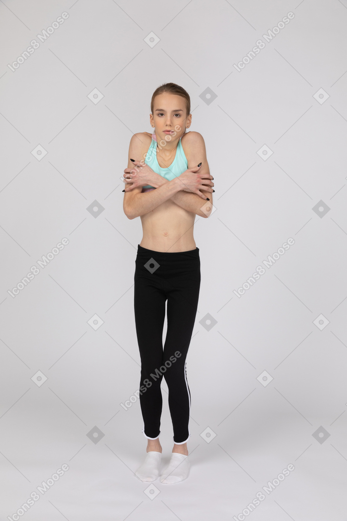 Front view of shivering teen girl