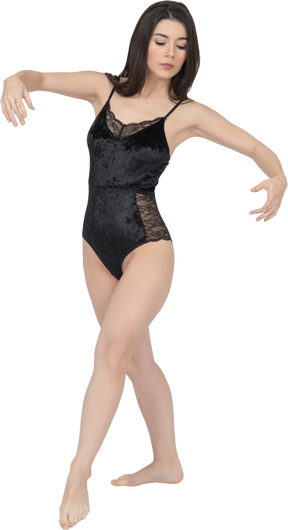 Female in black bodysuit posing in dancing position