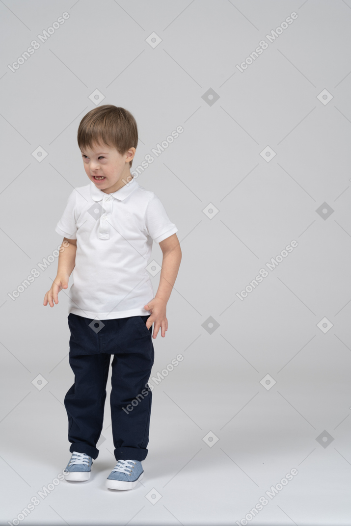 Front view of little boy looking irritated