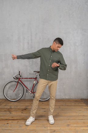 Man checking the time while asking for a ride