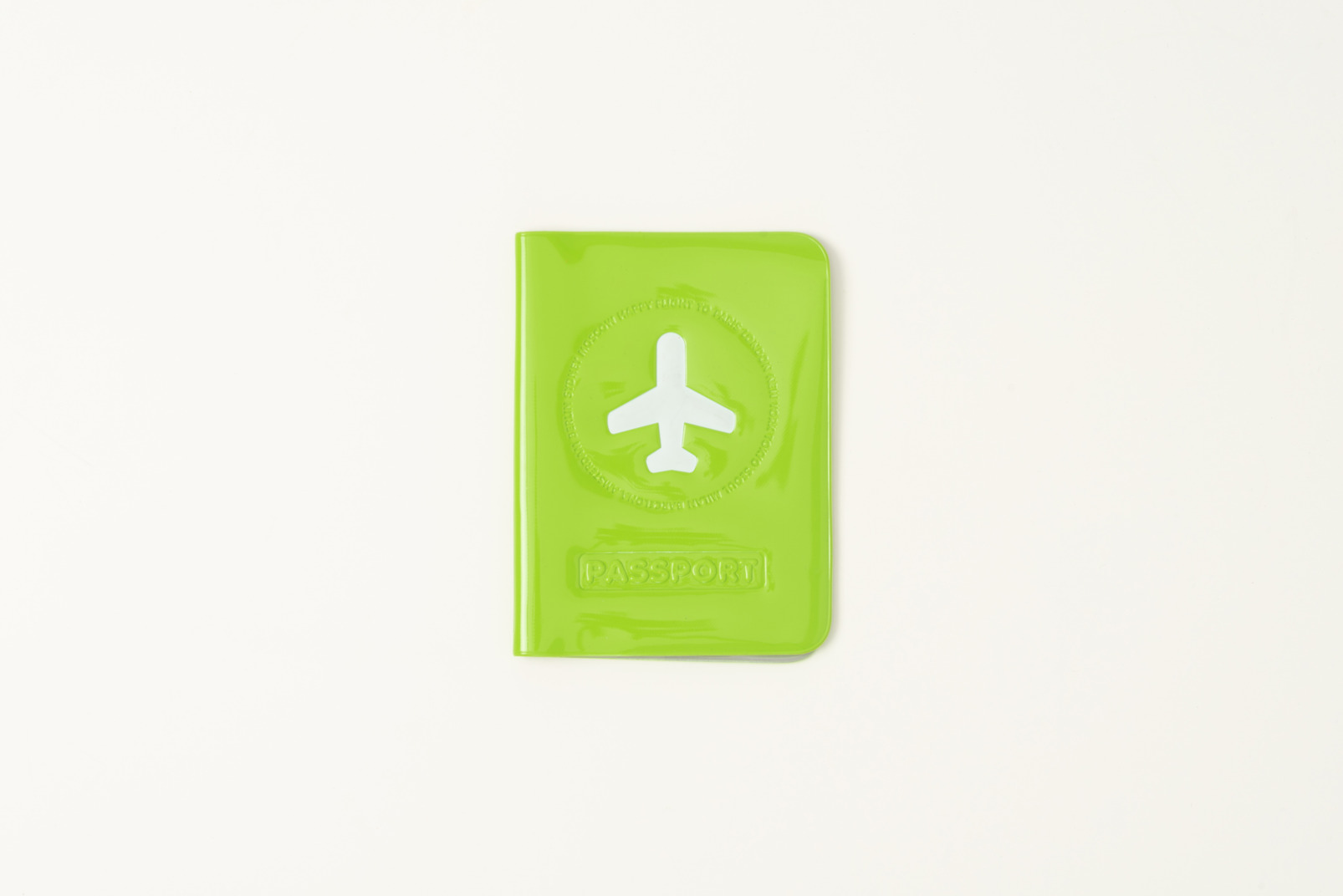 Green passport cover on a white background