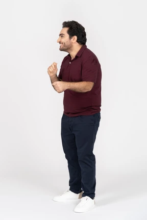 A laughing young man wearing casual clothes