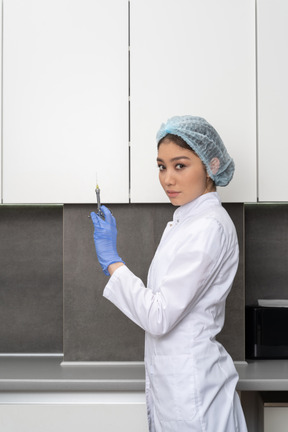 A healthcare worker with syringe