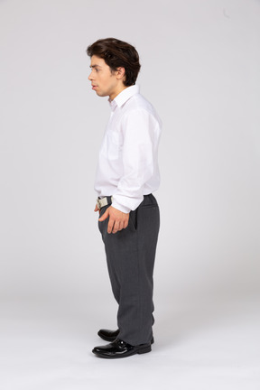 Side view of young man standing